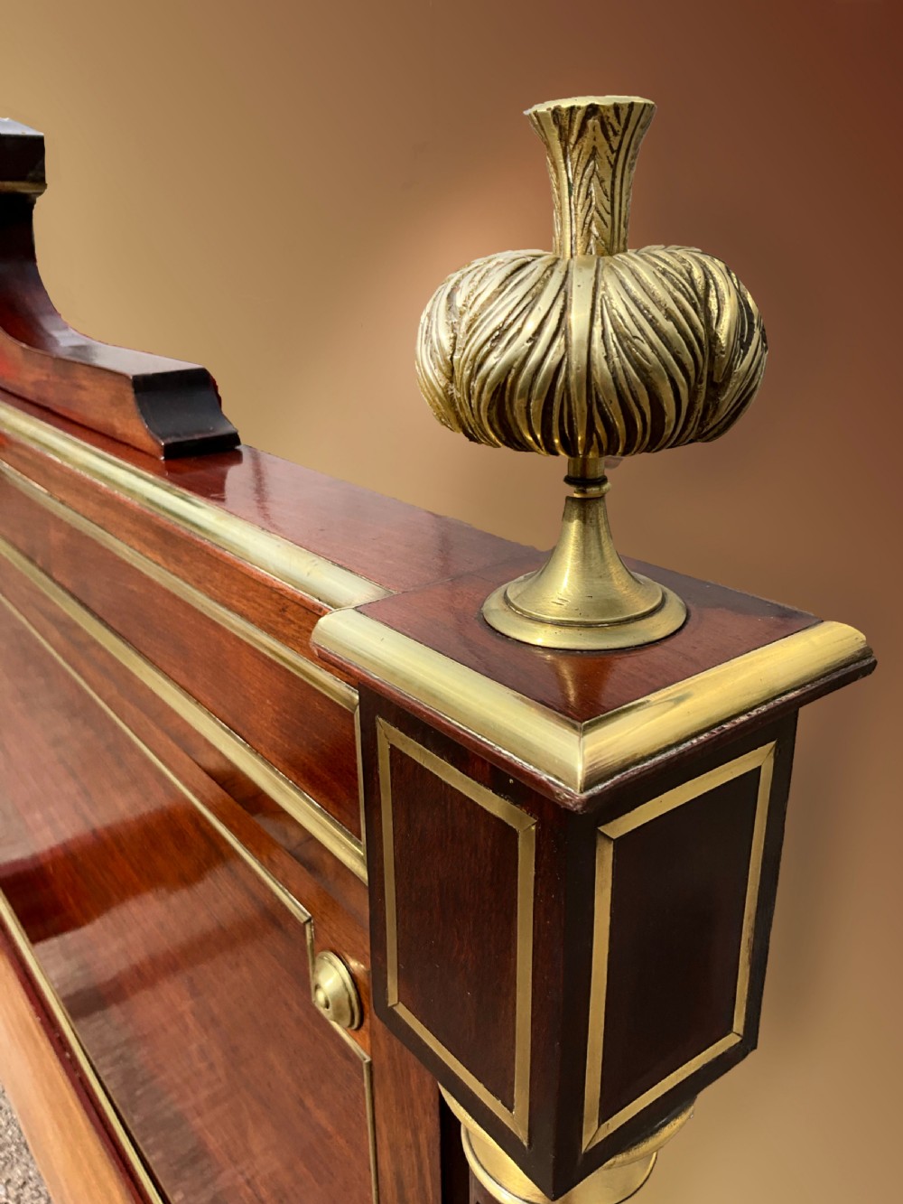 A mahogany and brass French Empire style bed. View III