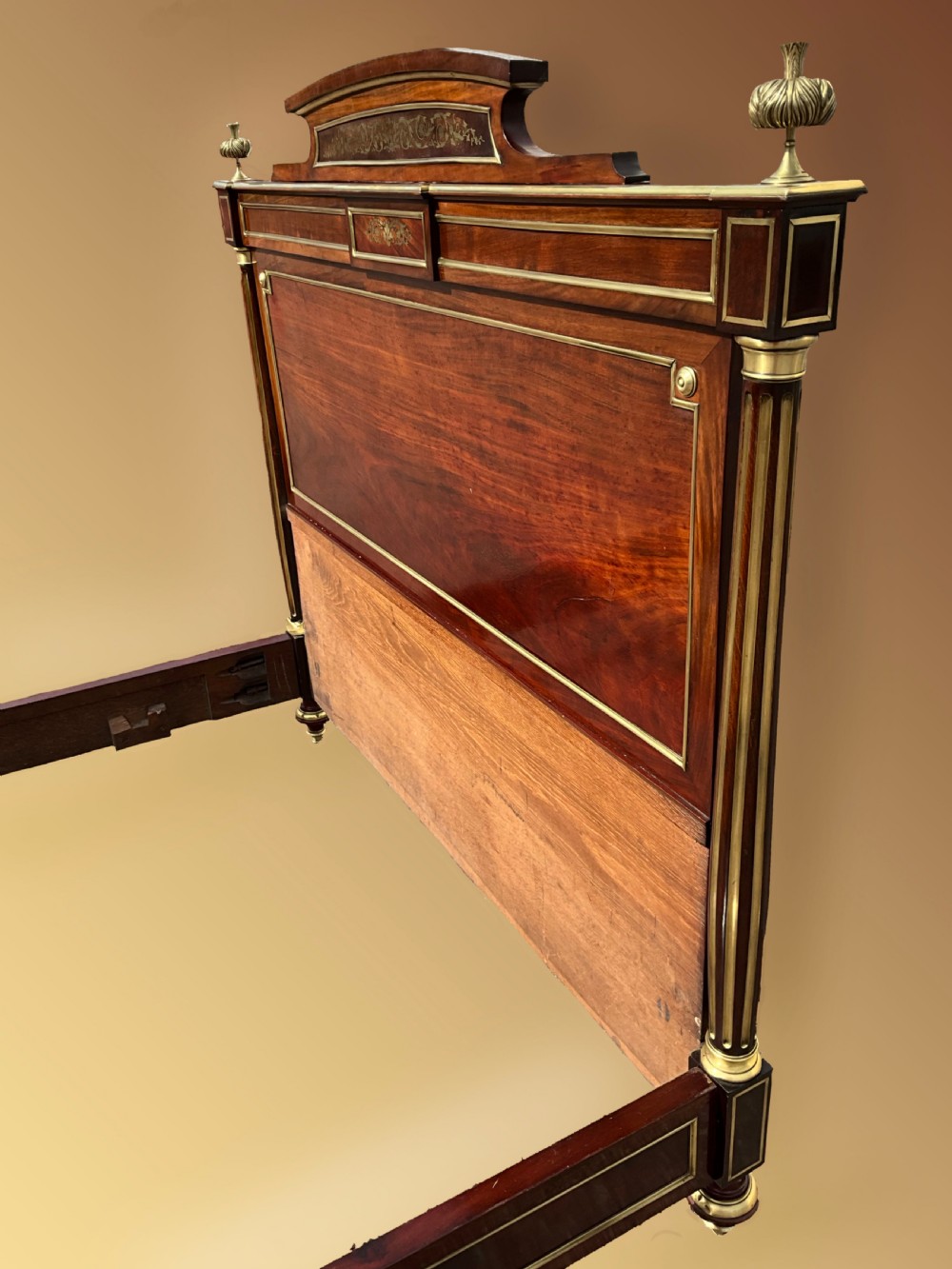 A mahogany and brass French Empire style bed. View V