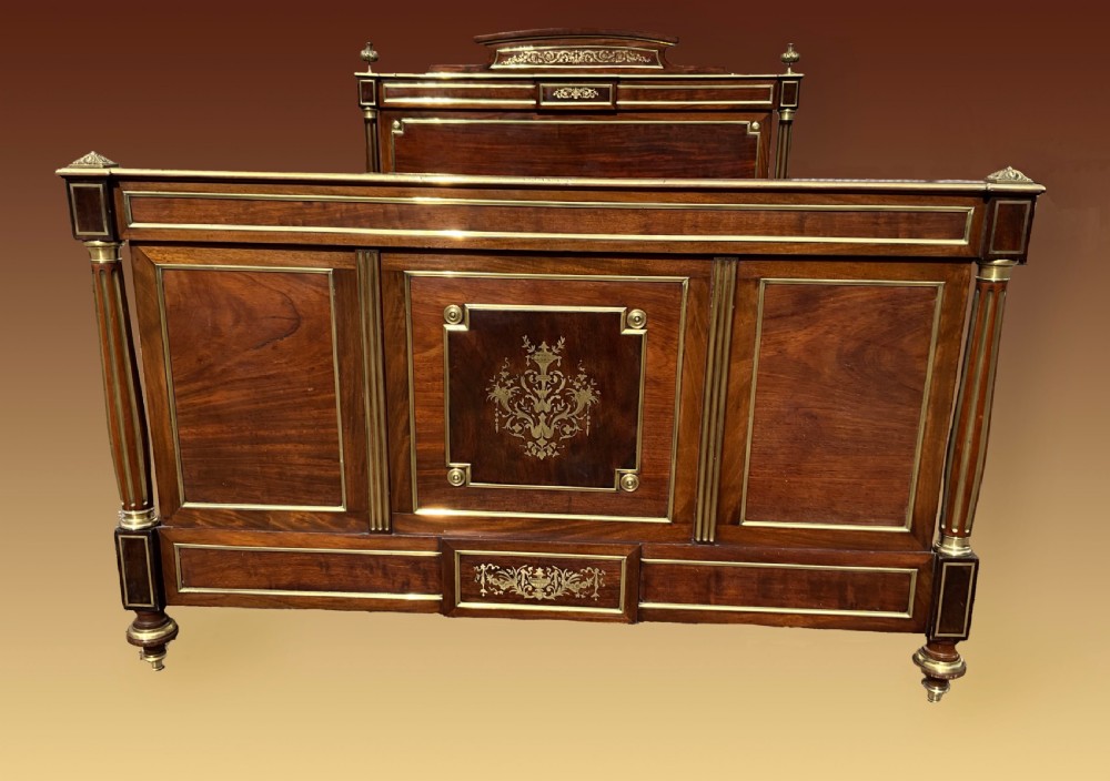 A mahogany and brass French Empire style bed. View VI