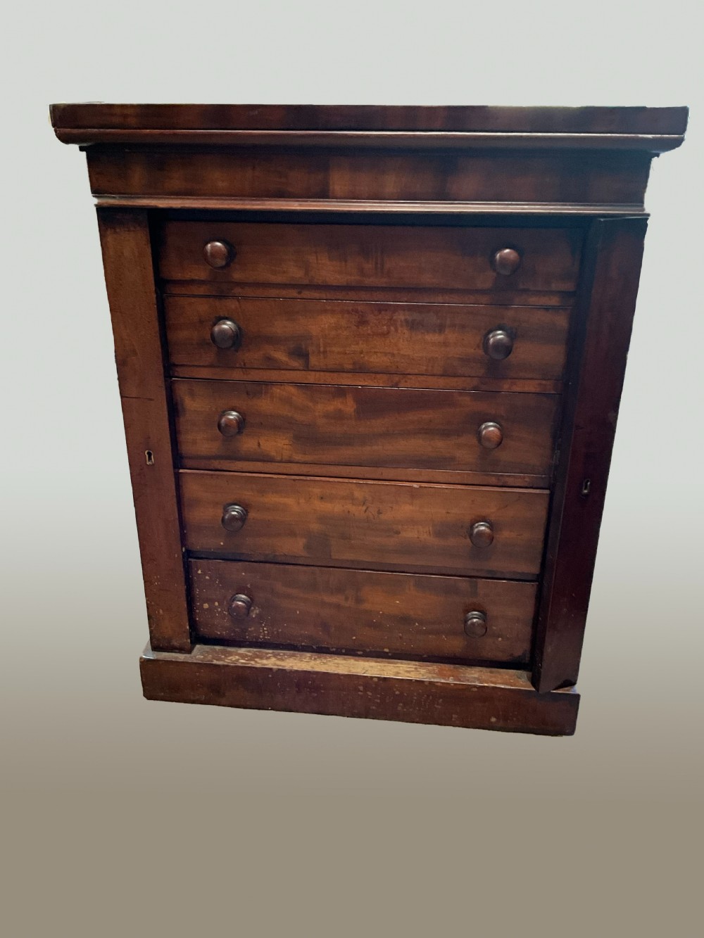 An unusual small Victorian mahogany wellington chest. c1860.  View III