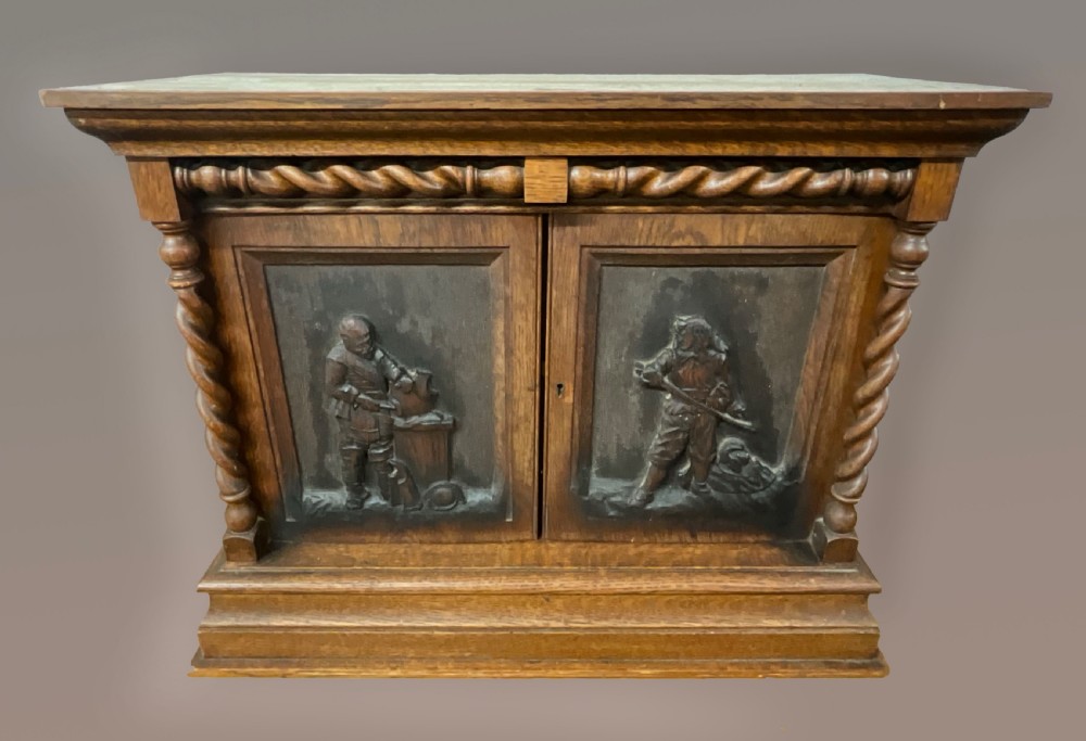 A small two door oak cabinet. Circa 1900. 
