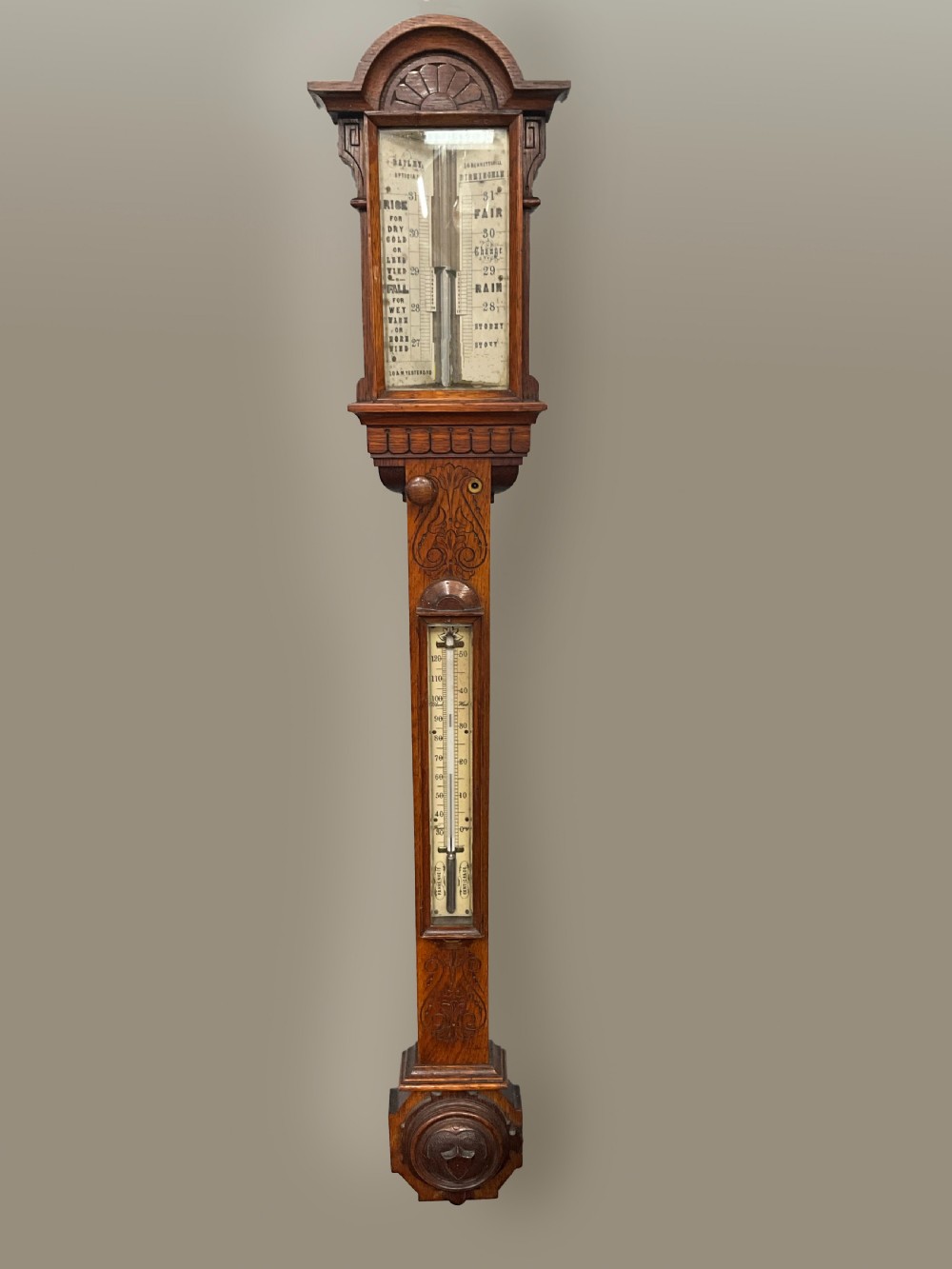 A 19th century Birmingham oak stick barometer and thermometer.