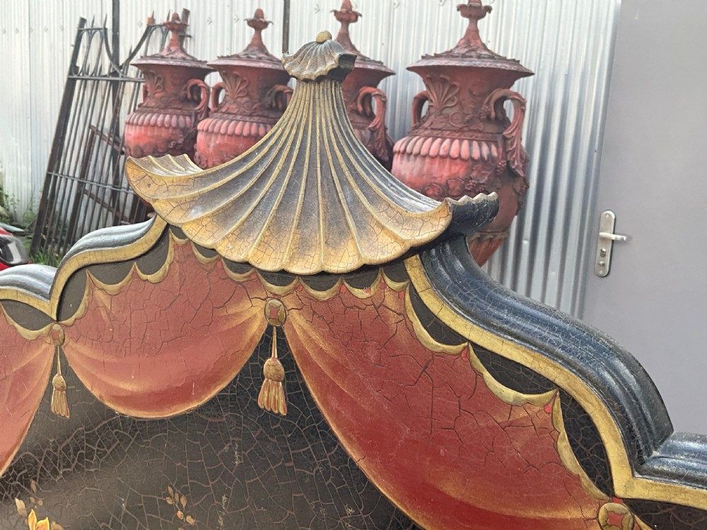 A pair of black lacquered single bed frames decorated with gold painted East Asian landscape scenes, figures, and shaped pagoda headboards. View IV