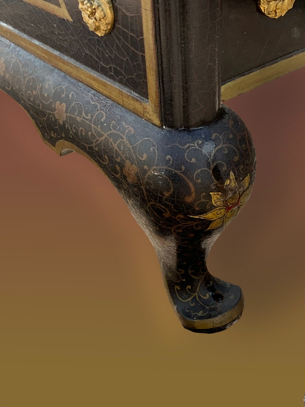 A pair of black lacquered single bed frames decorated with gold painted East Asian landscape scenes, figures, and shaped pagoda headboards. View VII