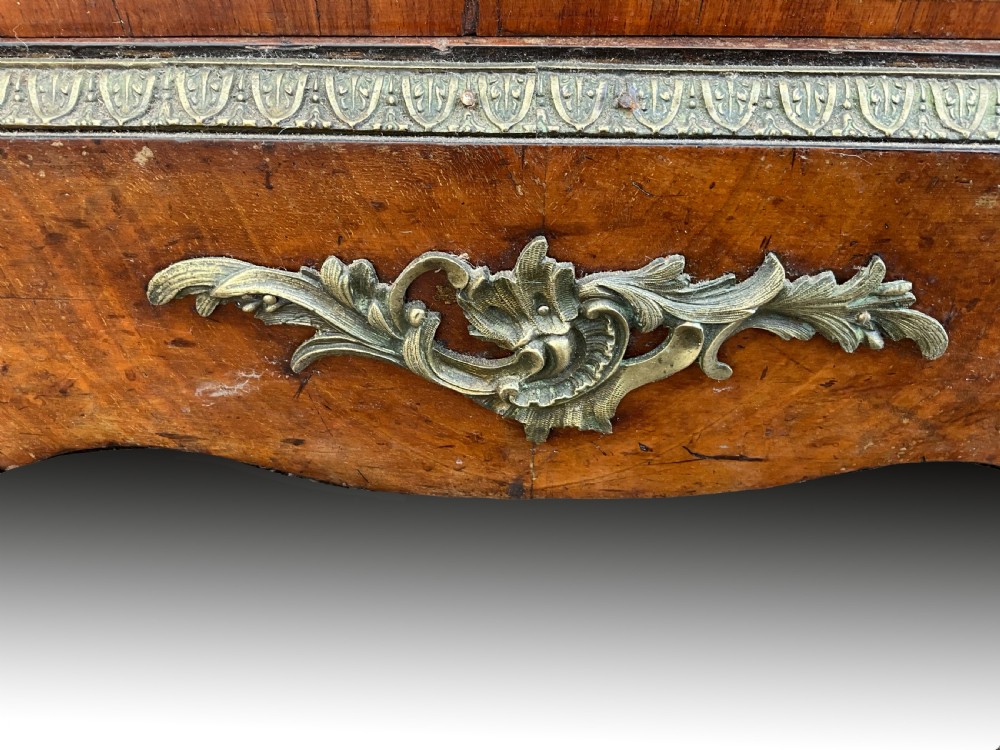 A Victorian burr walnut glazed cabinet featuring floral marquetry inlays, metal mounts, and a single glass door. View IV