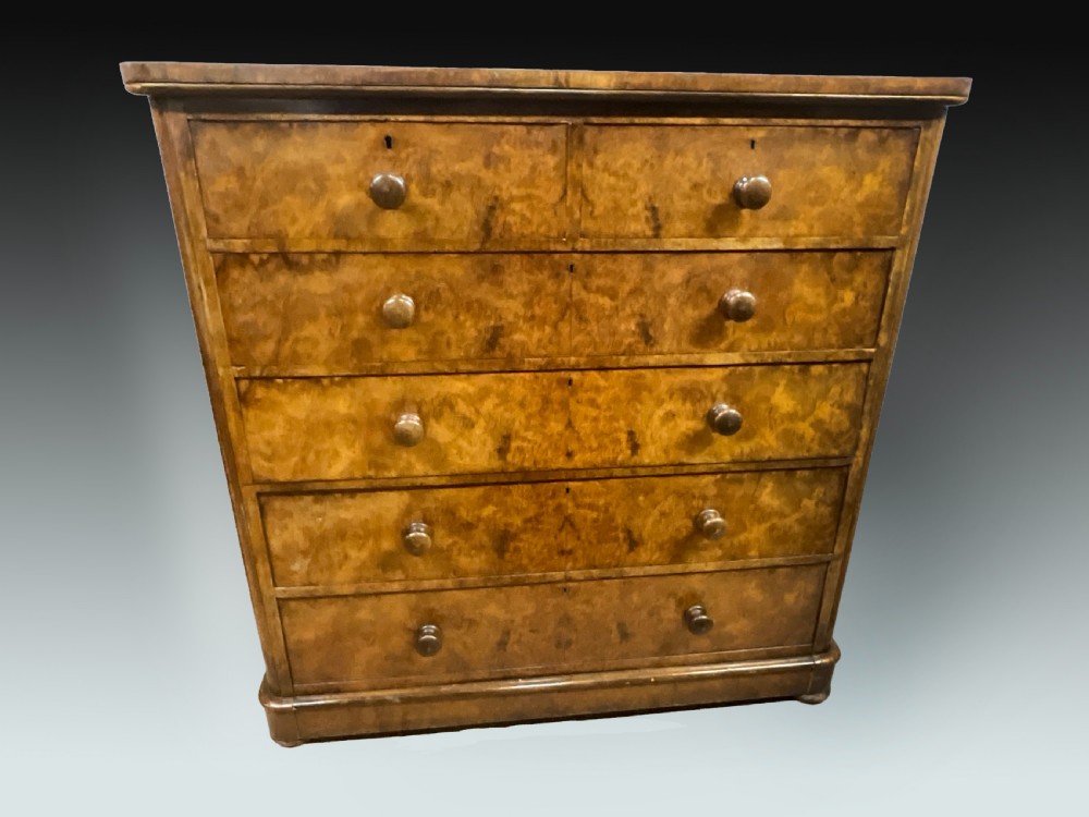 An English walnut chest of drawers