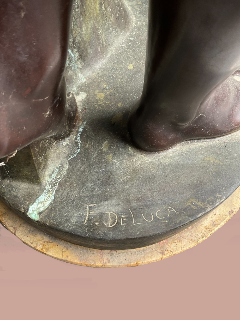 A classical bronze sculpture of a standing female figure holding a small sphere beside draped fabric on a marble base. View VI