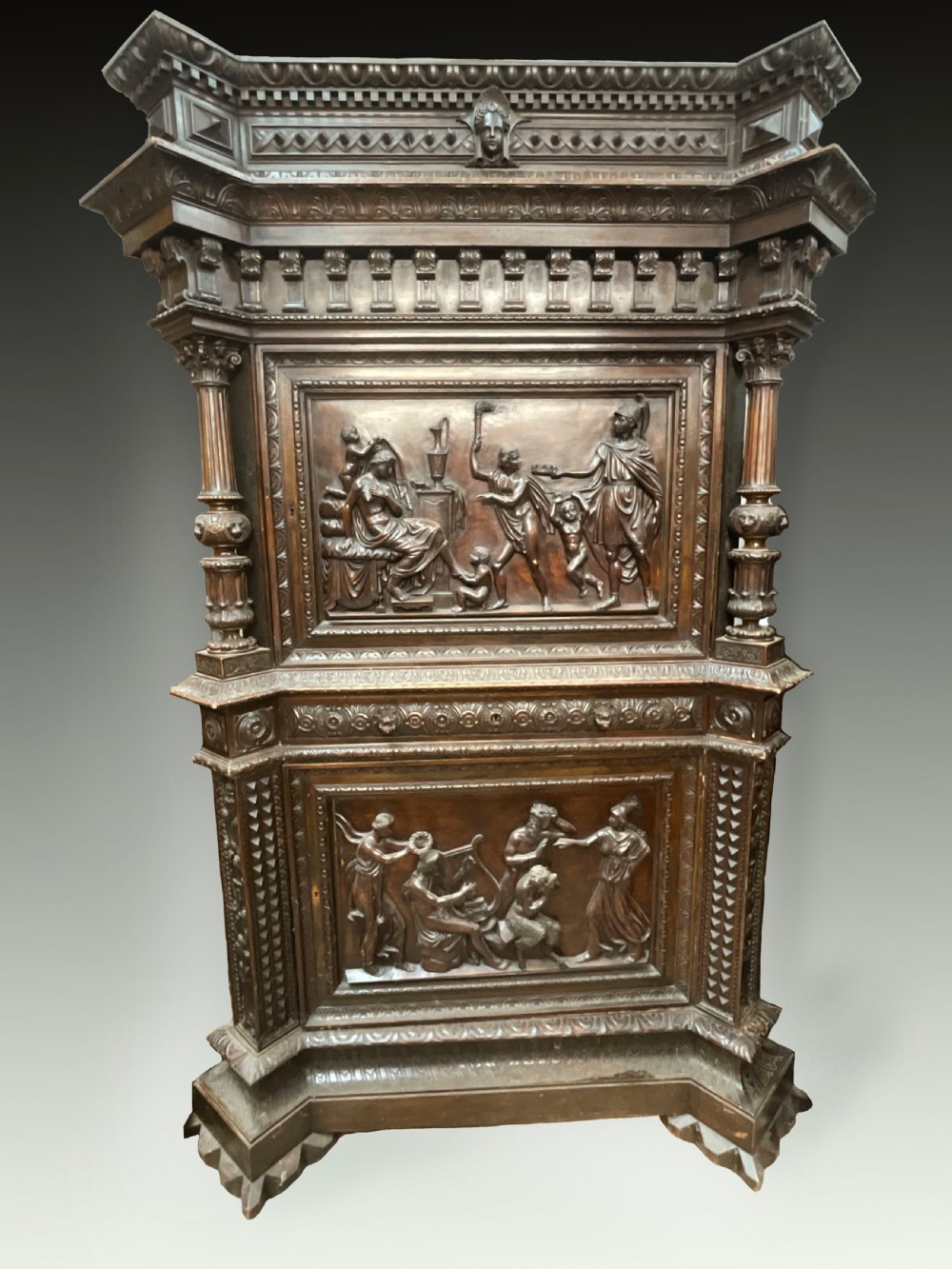 A very large fine Italian walnut carved cabinet. 