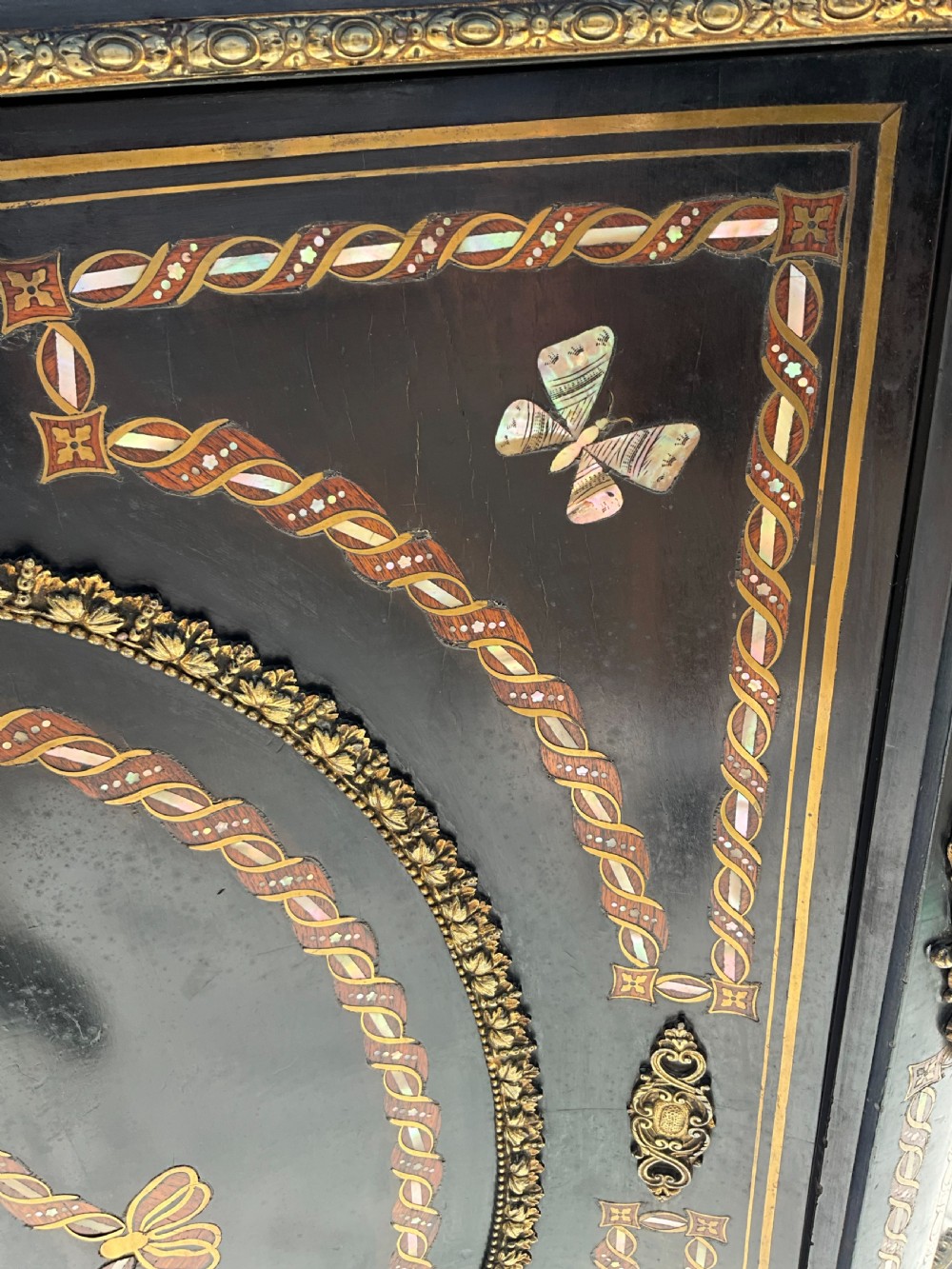 For sale is this French serpentine fronted, ebonised and inlaid marble topped side cabinet. c.1870. View V