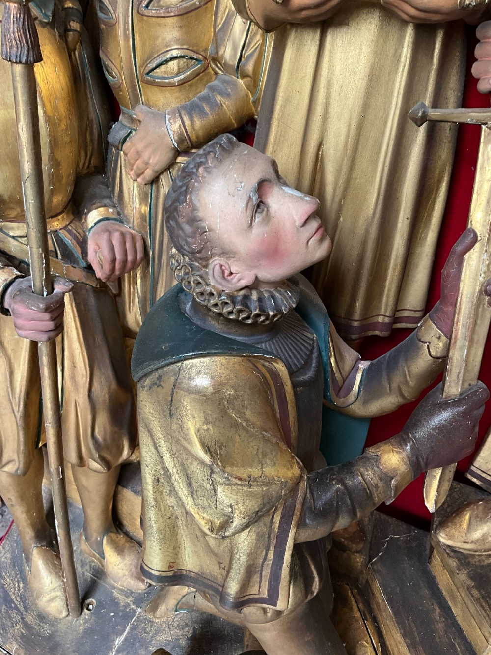 A mid-19th-century carved and gilded wooden figure group depicting multiple Renaissance figures against a red velvet backing. View VII