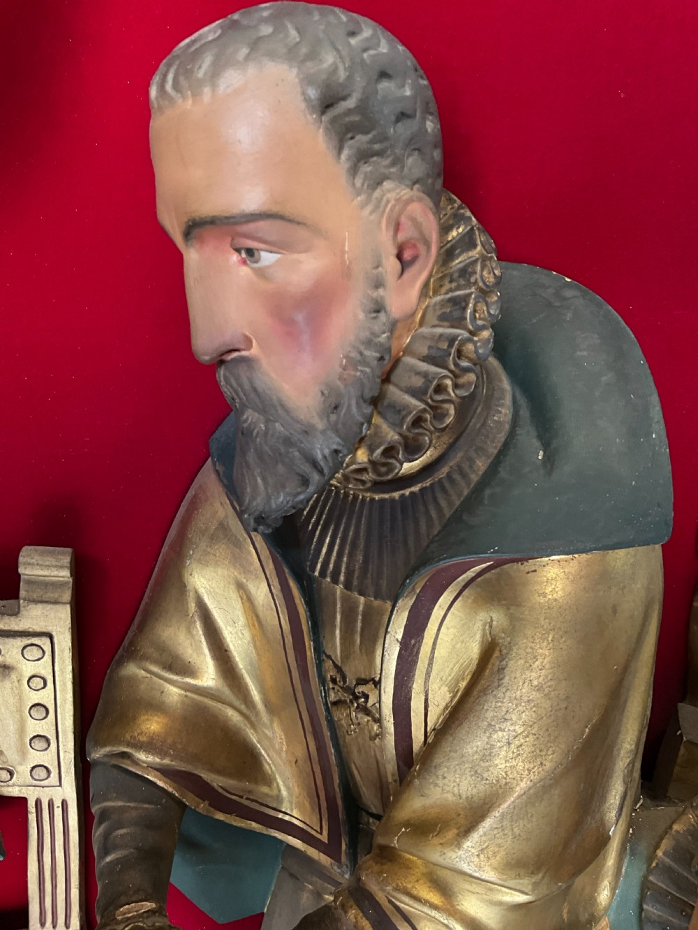 A mid-19th-century carved and gilded wooden figure group depicting multiple Renaissance figures against a red velvet backing. View VIII