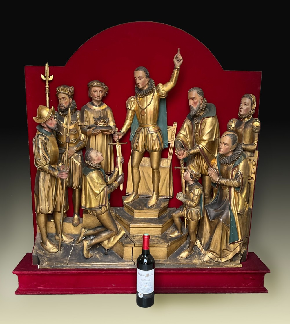 A mid-19th-century carved and gilded wooden figure group depicting multiple Renaissance figures against a red velvet backing. View XI