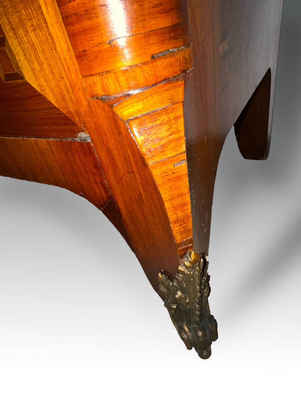 An antique French style marquetry writing cabinet featuring a marble top, tambour shutter front, middle drawer, floral inlaid doors, and brass mounts. View IV