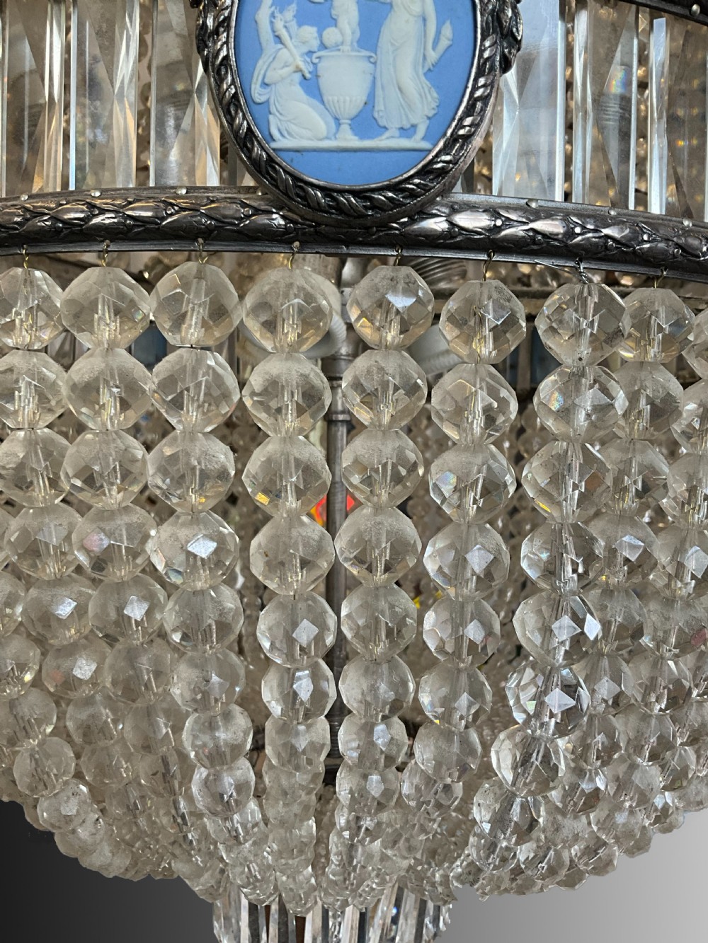 An antique crystal tent and bag chandelier featuring silvered metal bands inset with oval blue Wedgwood jasperware cameo plaques. View III