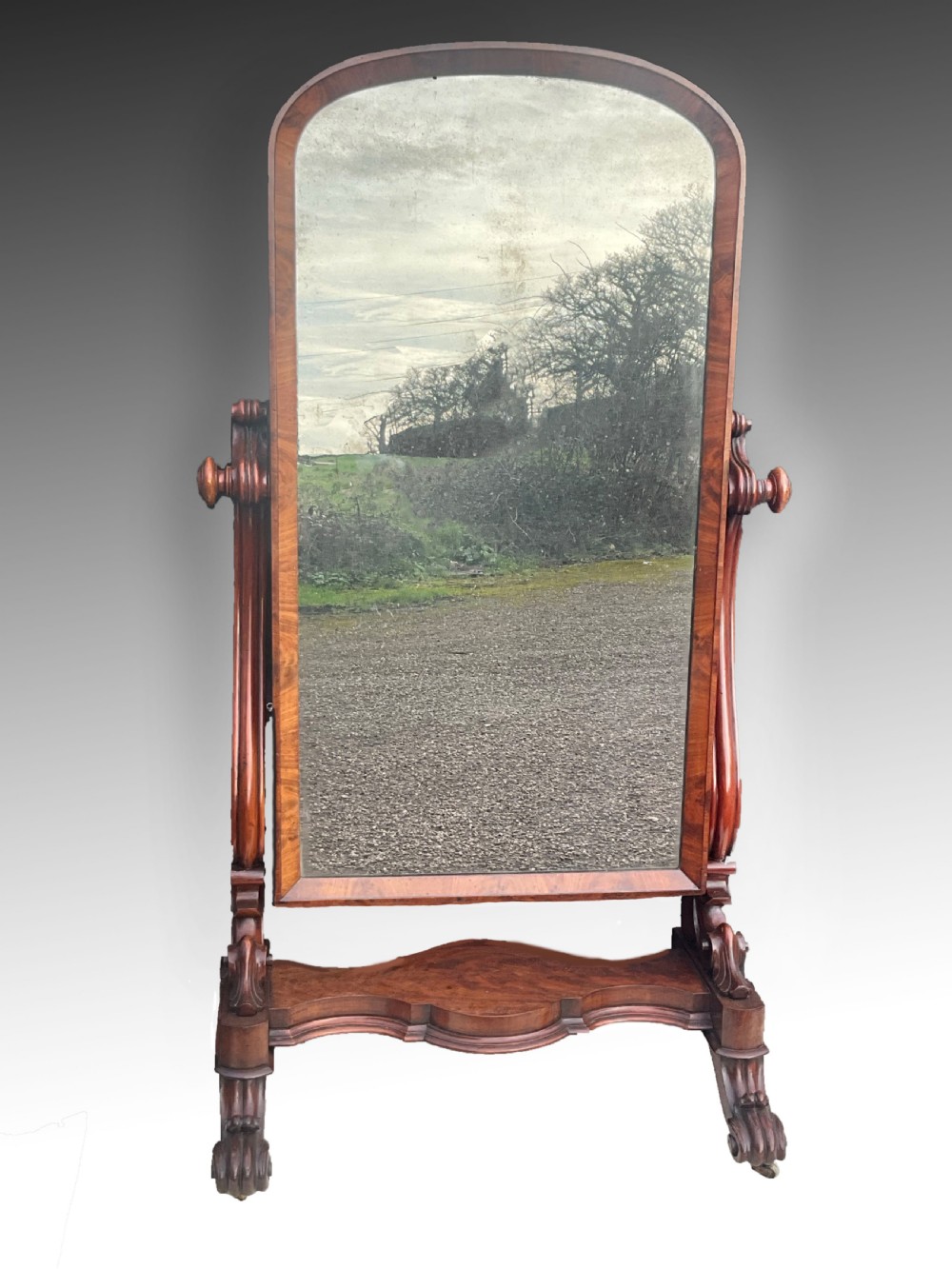 A Victorian mahogany cheval mirror. Circa 1860.