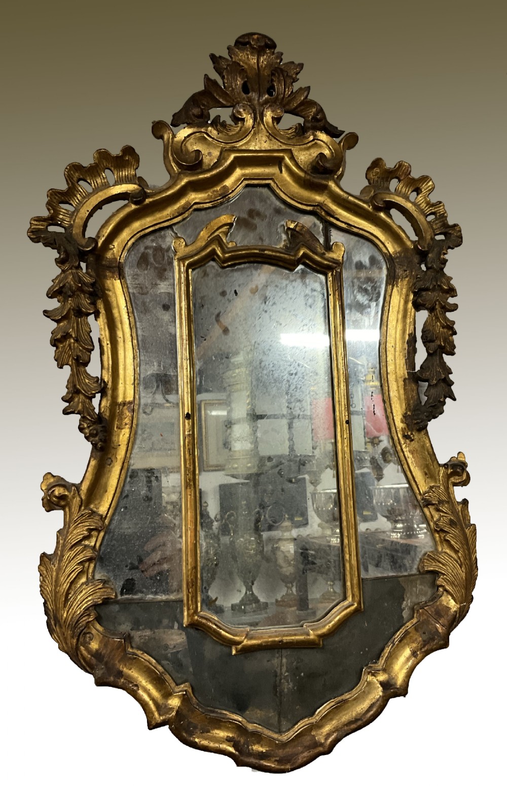 An 18th century continental gilt wood wall mirror