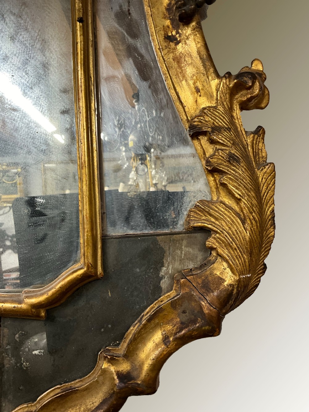 An 18th century continental gilt wood wall mirror View V