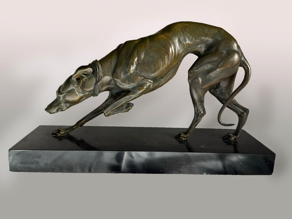 A large Bronze greyhound on marble base.