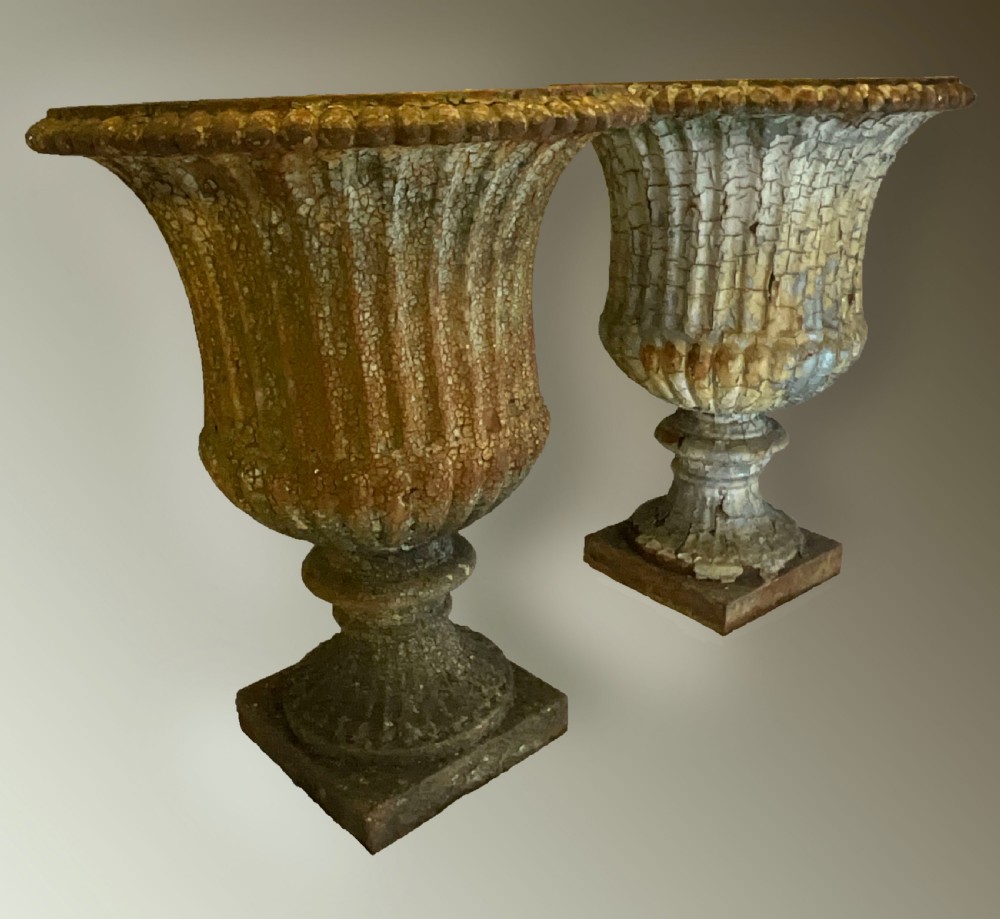 An extremely attractive pair of heavy cast iron garden urns.
