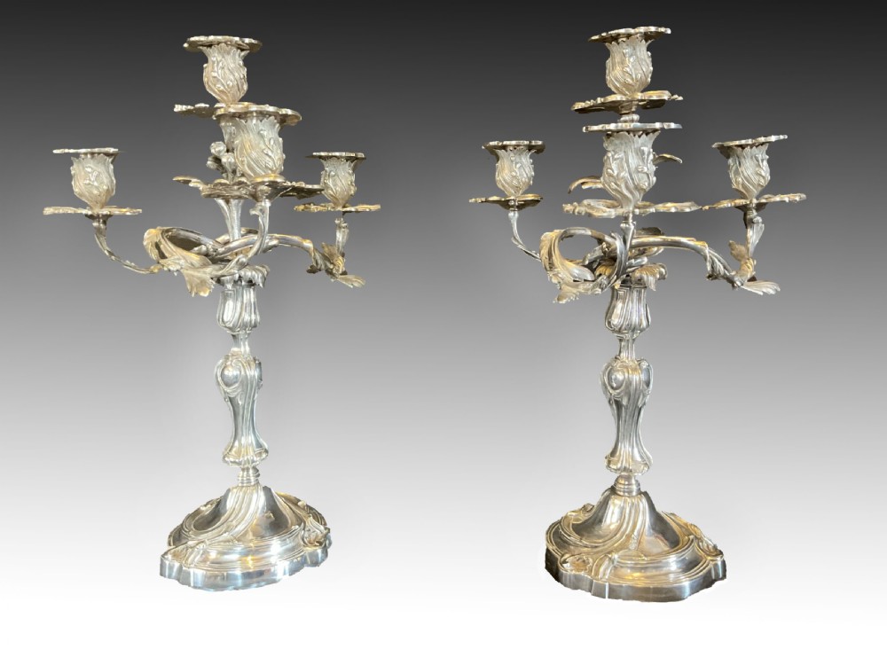 A High Quality Pair of Silver Plated Four Flame Candelabra's. Marked HV. 