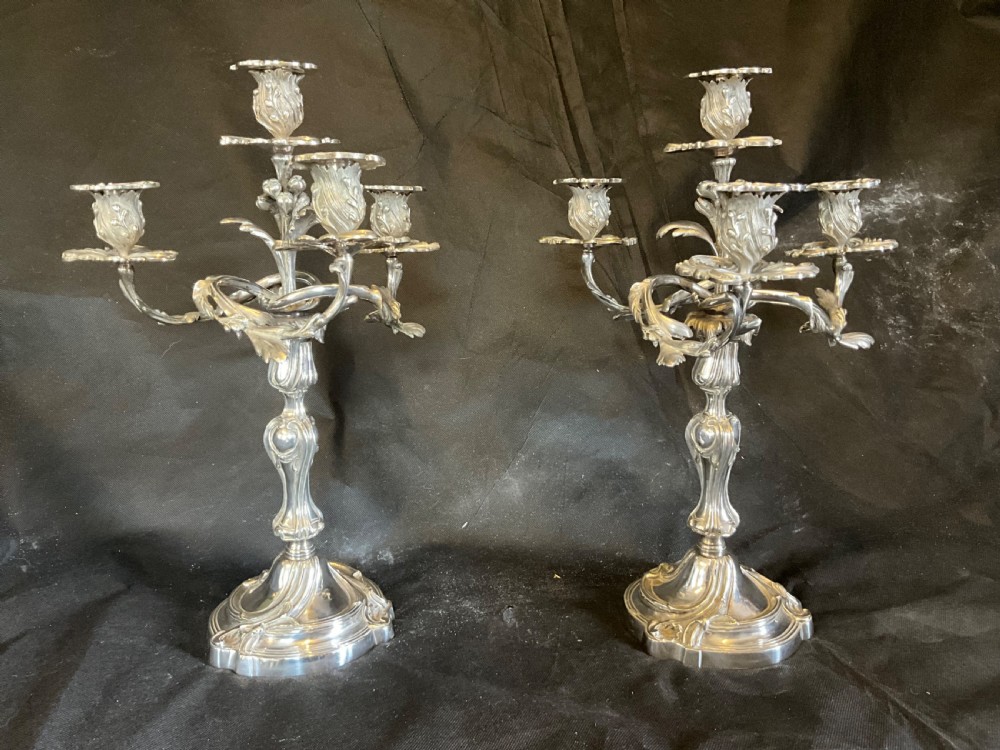 A High Quality Pair of Silver Plated Four Flame Candelabra's. Marked HV.  View XVI