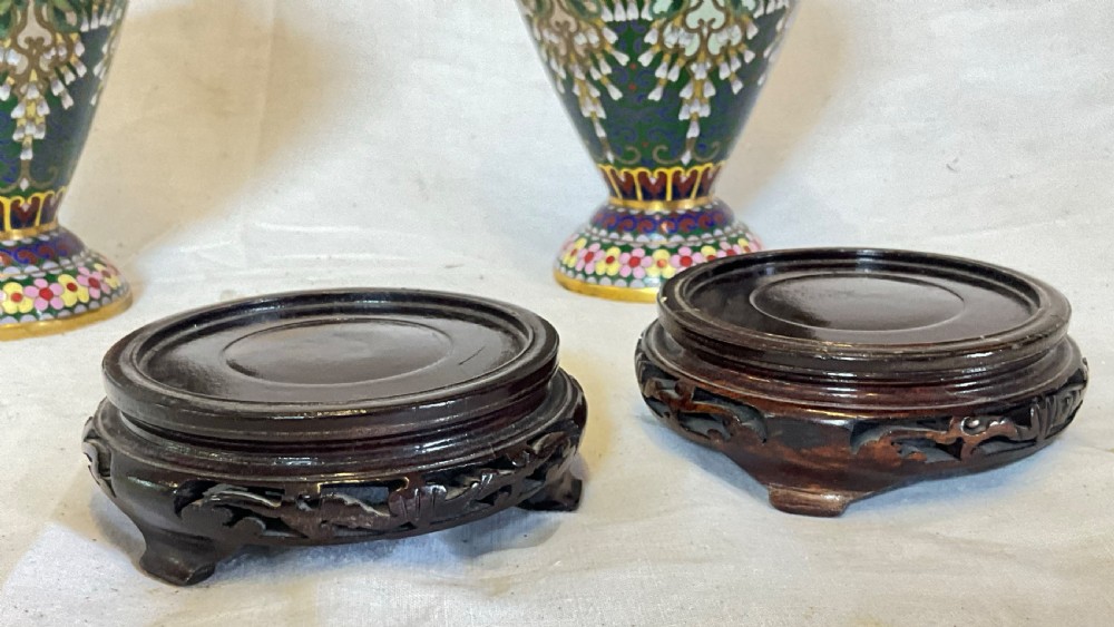 A delightfully decorative pair of Cloisonné vases on wooden bases View II