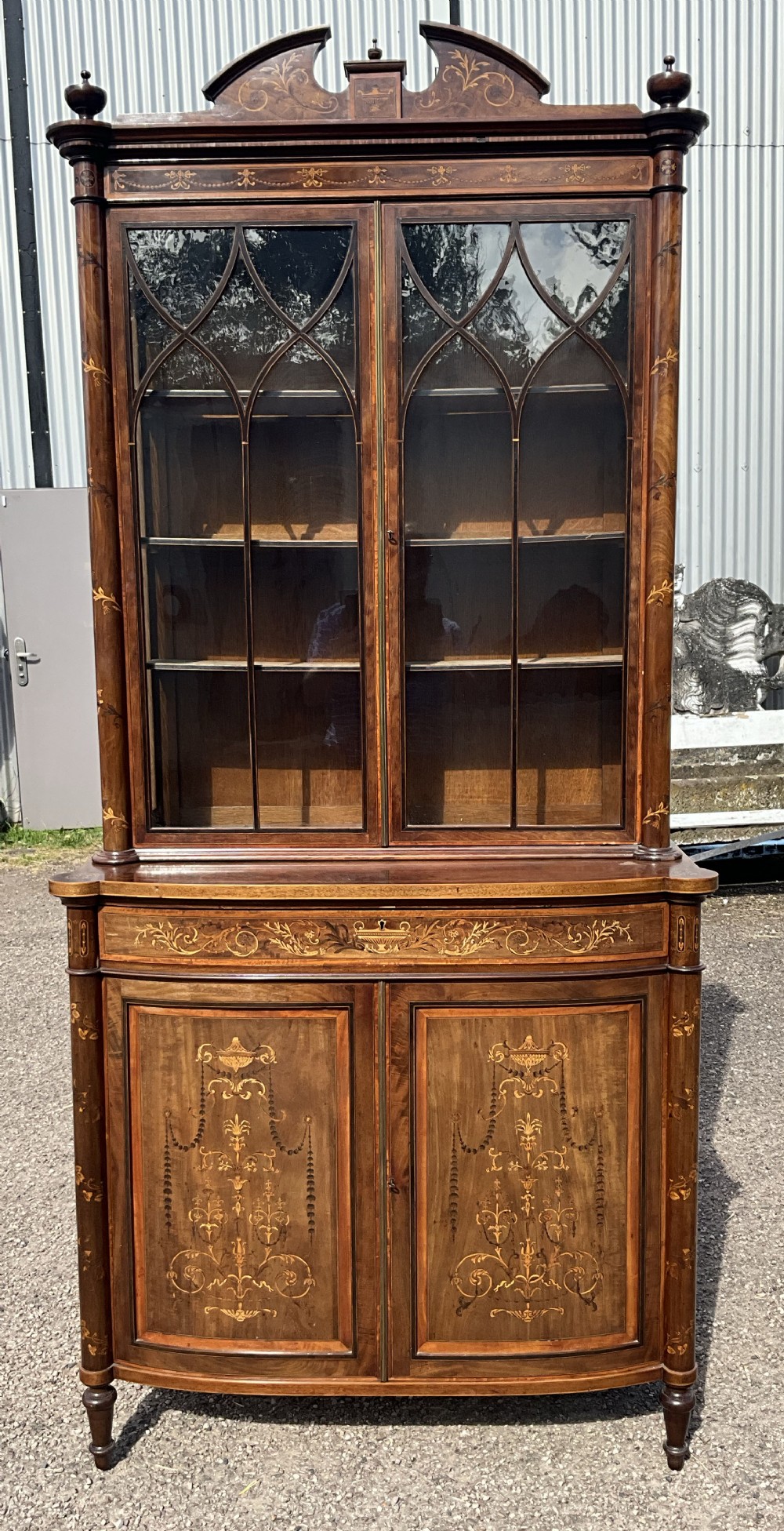 An attractive and fine quality marquetry and mahogany glazed top bookcase. Circa 1880. 