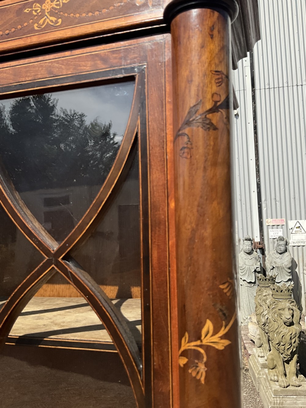 An attractive and fine quality marquetry and mahogany glazed top bookcase. Circa 1880.  View IV