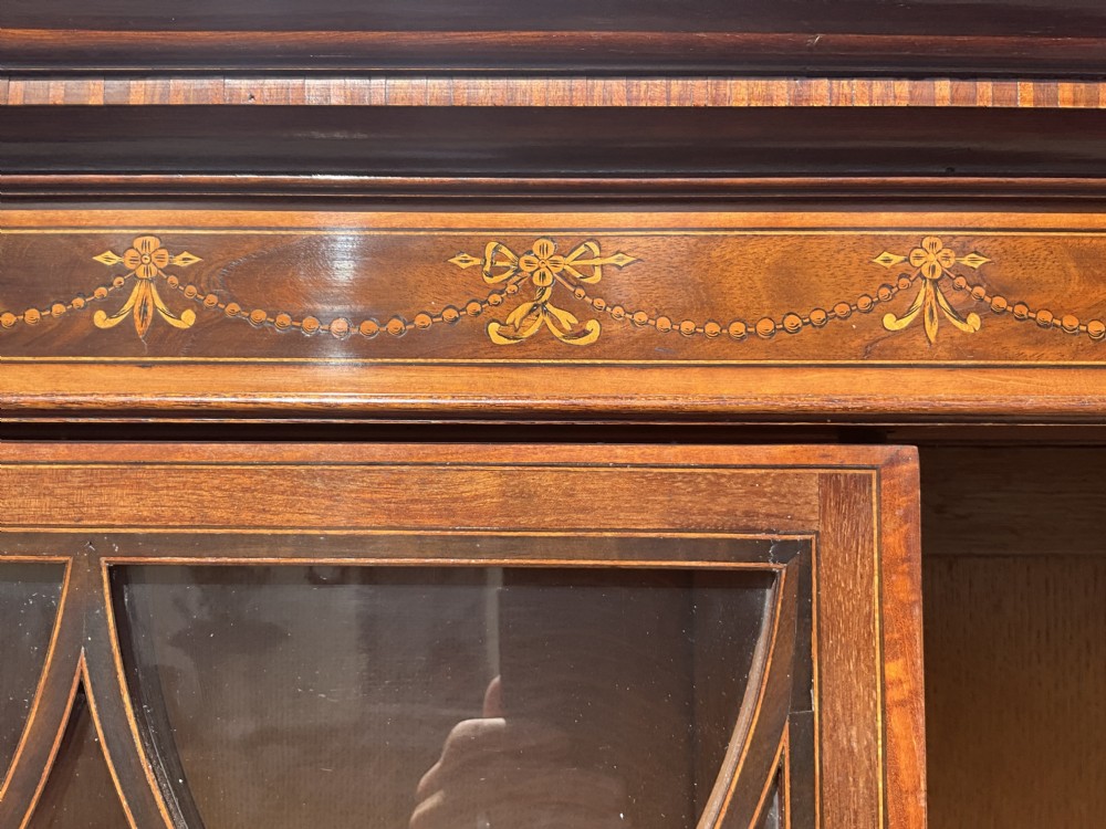 An attractive and fine quality marquetry and mahogany glazed top bookcase. Circa 1880.  View V