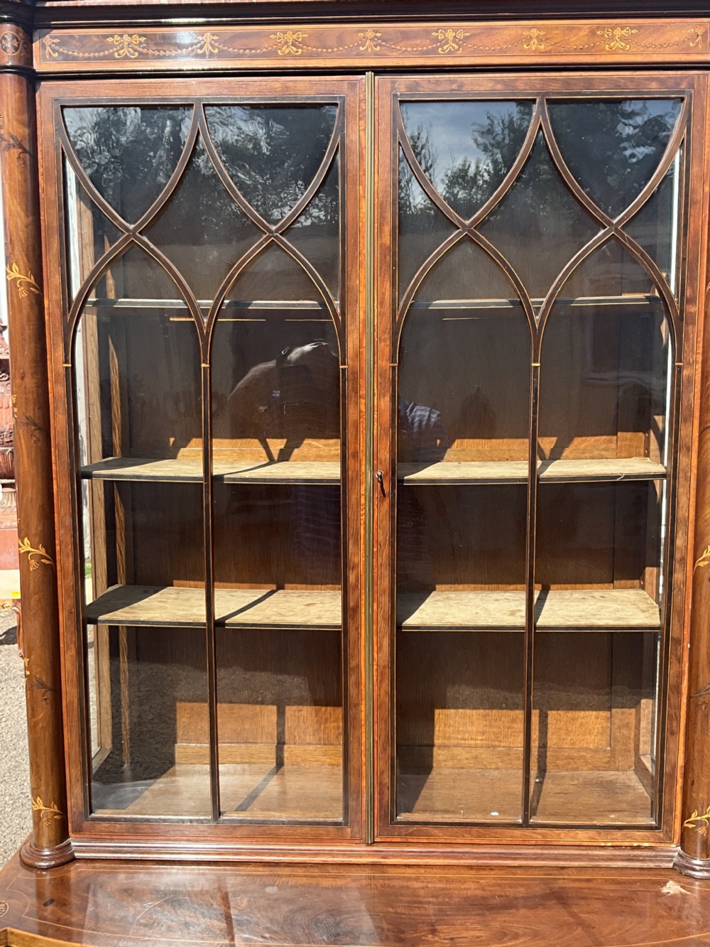 An attractive and fine quality marquetry and mahogany glazed top bookcase. Circa 1880.  View VI
