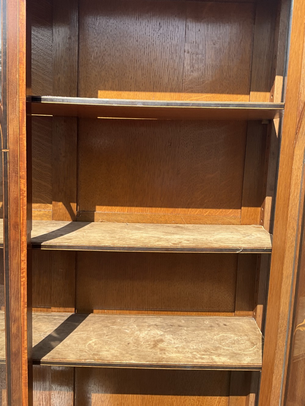 An attractive and fine quality marquetry and mahogany glazed top bookcase. Circa 1880.  View VII