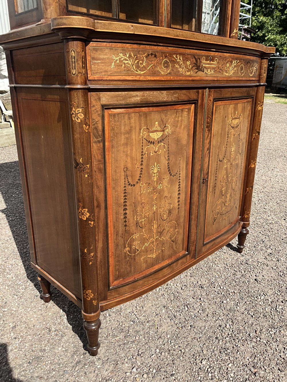 An attractive and fine quality marquetry and mahogany glazed top bookcase. Circa 1880.  View XI
