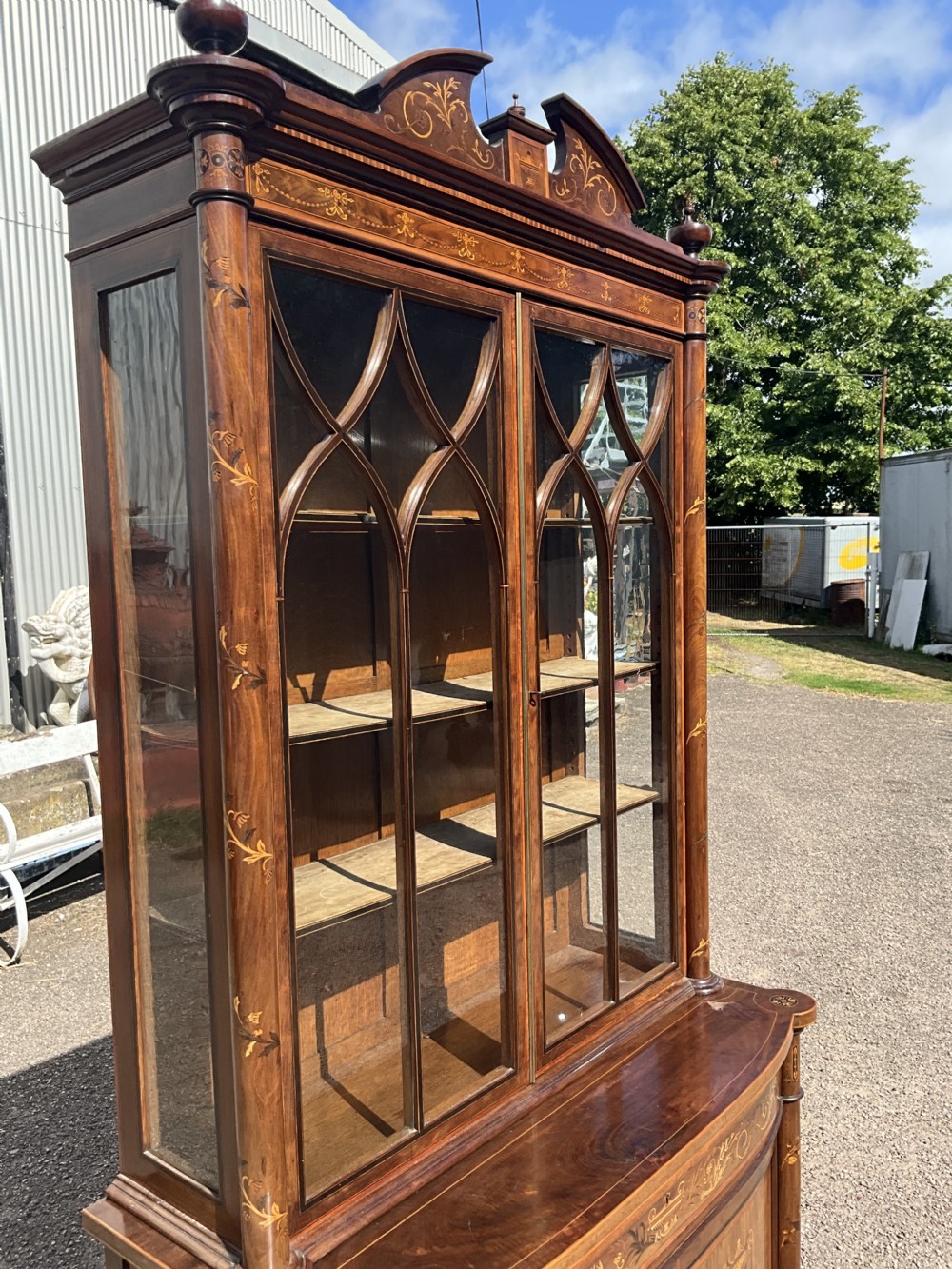 An attractive and fine quality marquetry and mahogany glazed top bookcase. Circa 1880.  View XII