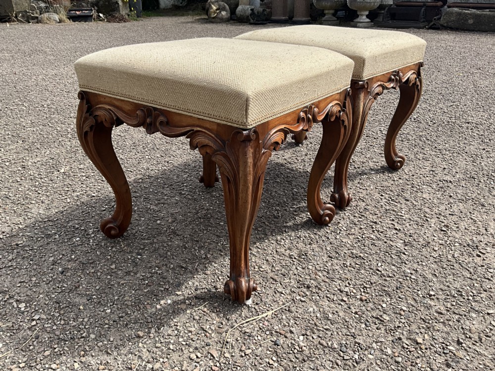 Offered for sale is this good looking pair of walnut upholstered stools. Circa 1860. View IV
