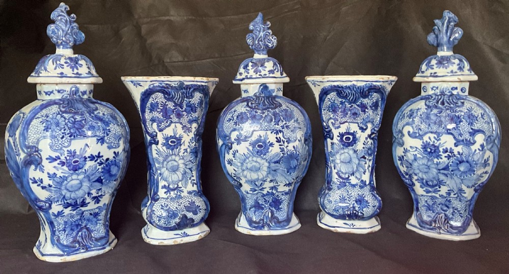 A set of five 18th century blue and white Delft garniture with original lids. Circa 1780. 