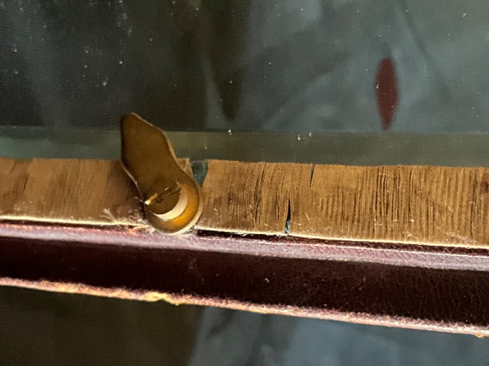 A miniature leather and gilt bound display cabinet. Circa 1880. View III