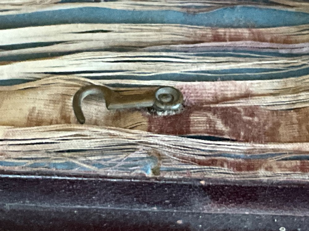 A miniature leather and gilt bound display cabinet. Circa 1880. View IV