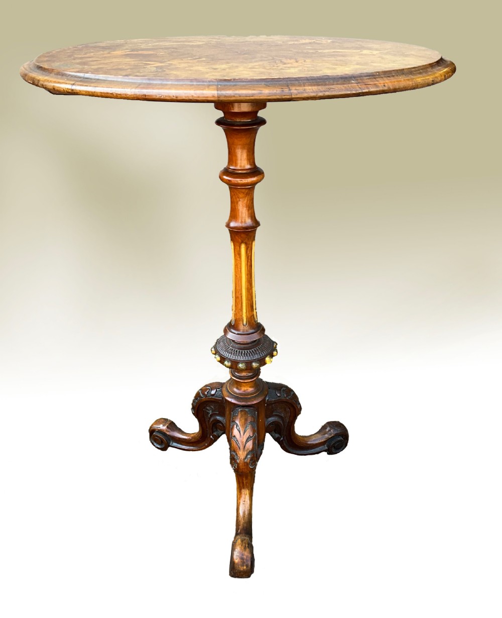 The finest quality eccentric walnut inlaid wine table.