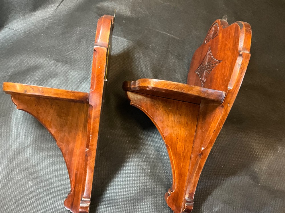 A pair of solid mahogany wall brackets View VI