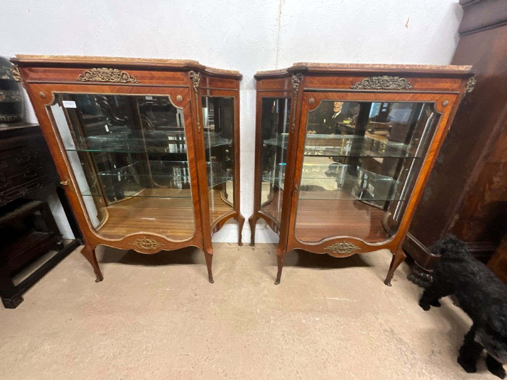 A pair of French marble topped kingwood display cabinets. View IV