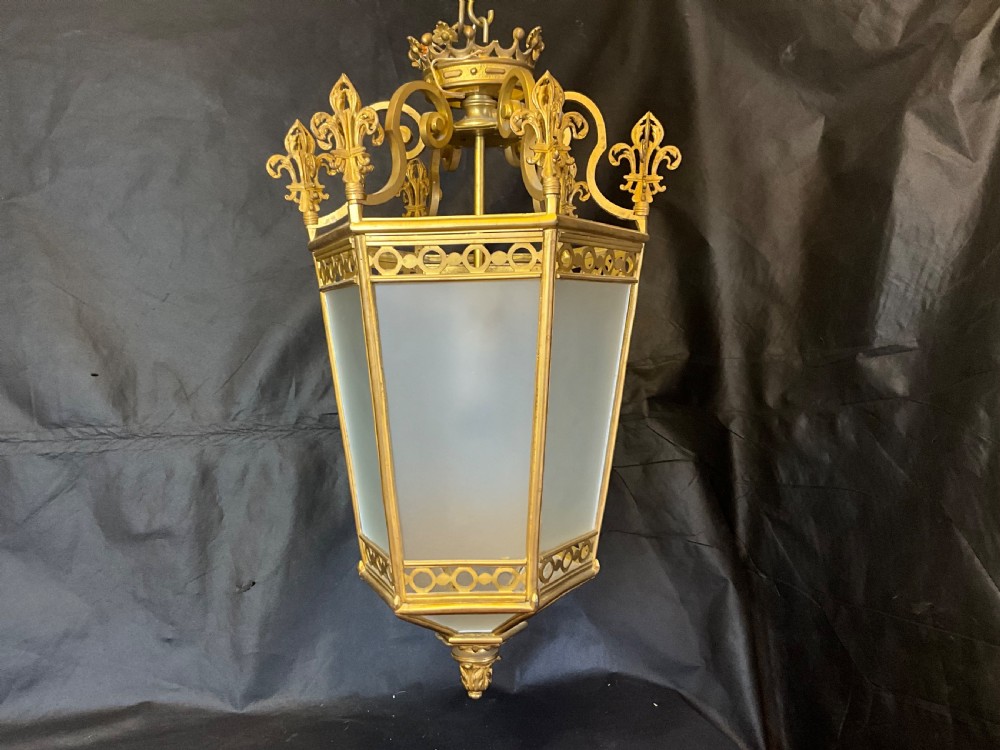 A French brass hall lantern with six opaque glass sides c1900.