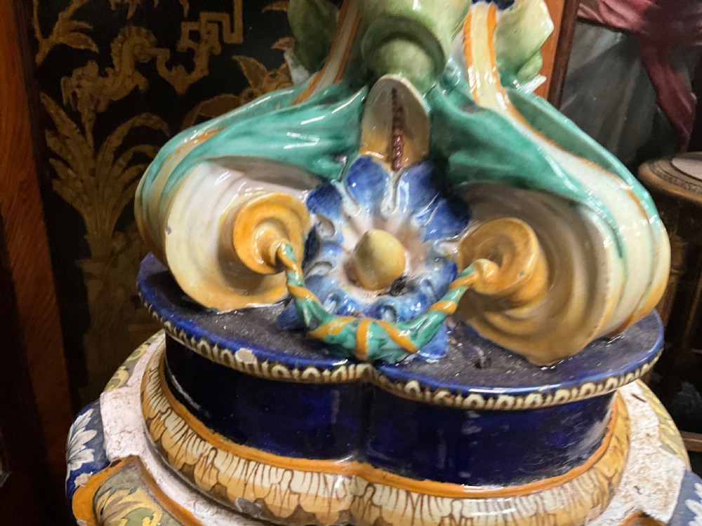 Large Italian Majolica tin-glazed earthenware vase with scrolled handles resting on an ornate matching pedestal base, decorated with painted mythological figures and relief masks. View XI