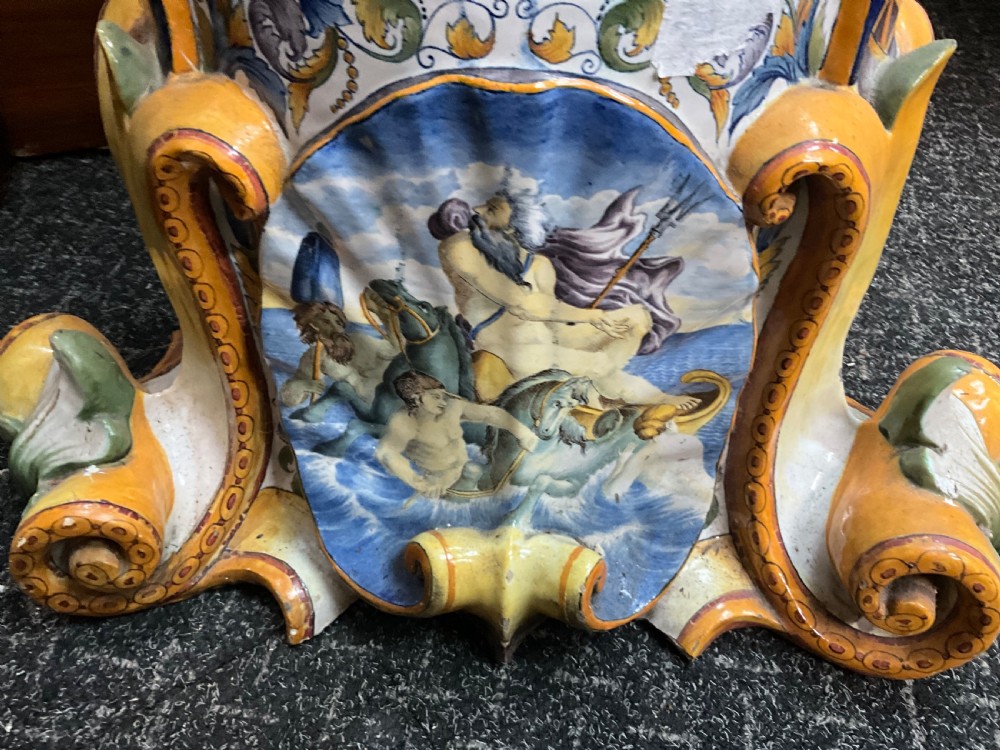 Large Italian Majolica tin-glazed earthenware vase with scrolled handles resting on an ornate matching pedestal base, decorated with painted mythological figures and relief masks. View XIII