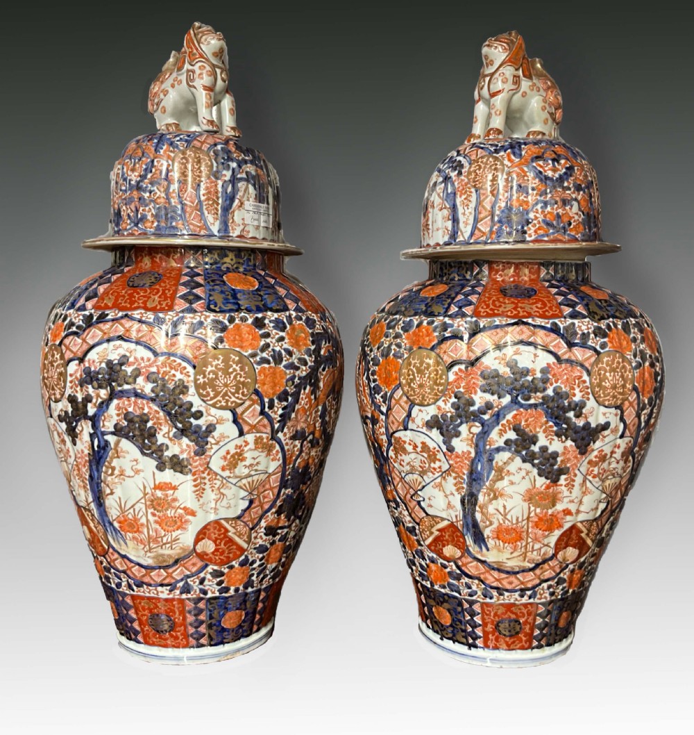 An impressively large pair of Imari lidded vases. 