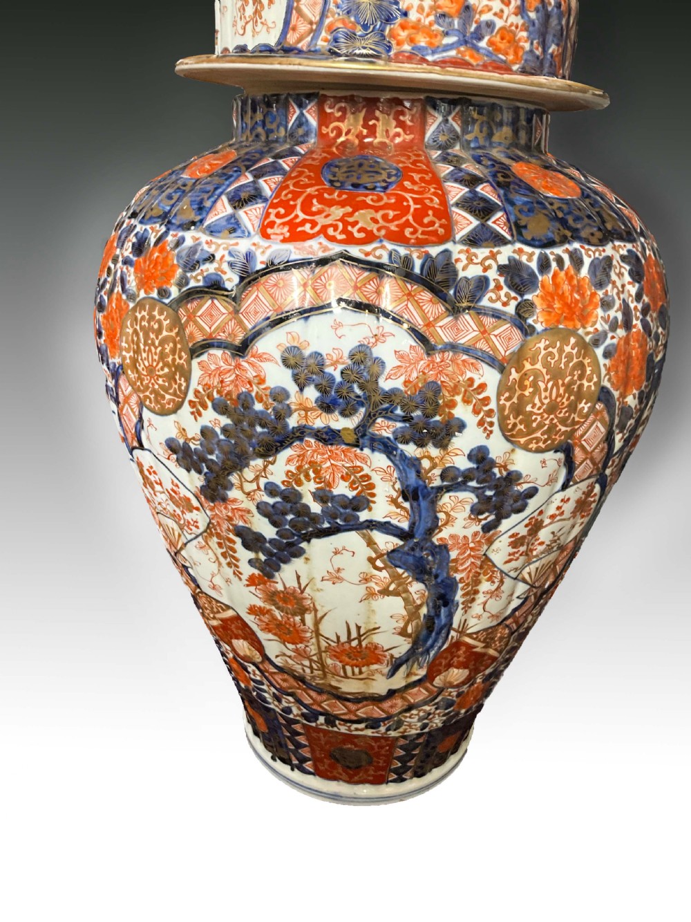 An impressively large pair of Imari lidded vases.  View II