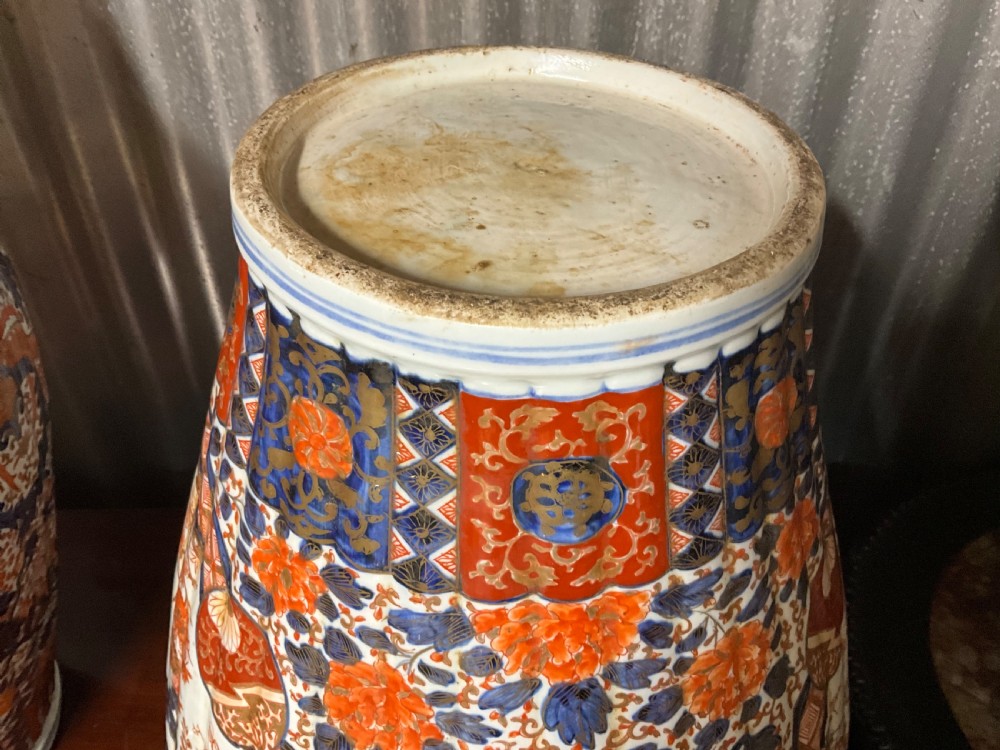 An impressively large pair of Imari lidded vases.  View IX