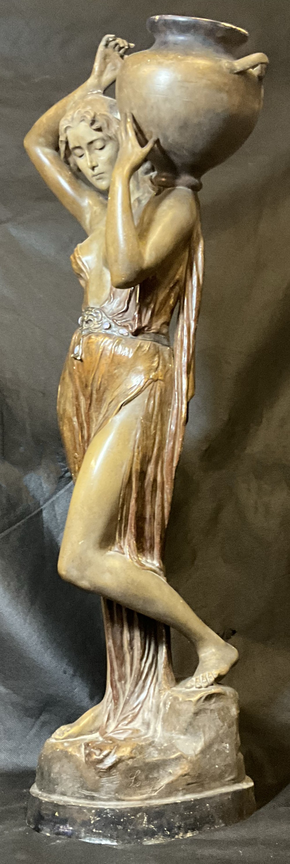 An elegant Goldscheider terracotta water carrier