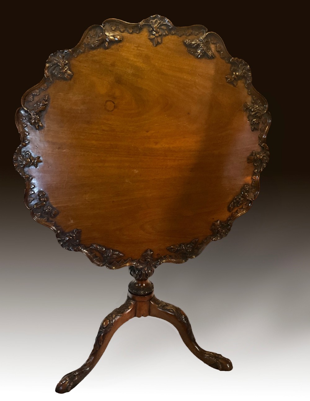 A mahogany tilt top table of consummate elegance.