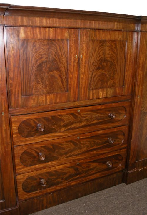 fig 1. FINE GEORGIAN FLAME MAHOGANY BREAKFRONT WARDROBE.