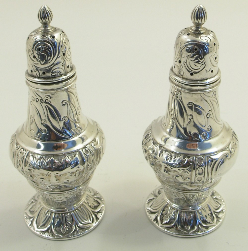 ORNATE PAIR OF VICTORIAN SILVER PEPPERETTES. 1888
